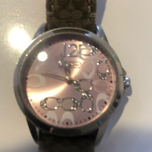 Coach khaki signature watch with pink accents.